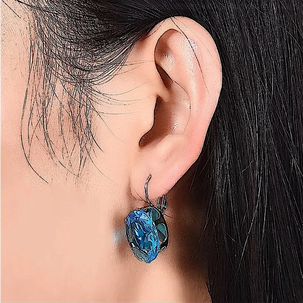 Blue Topaz Silver Oval Dangle Earrings